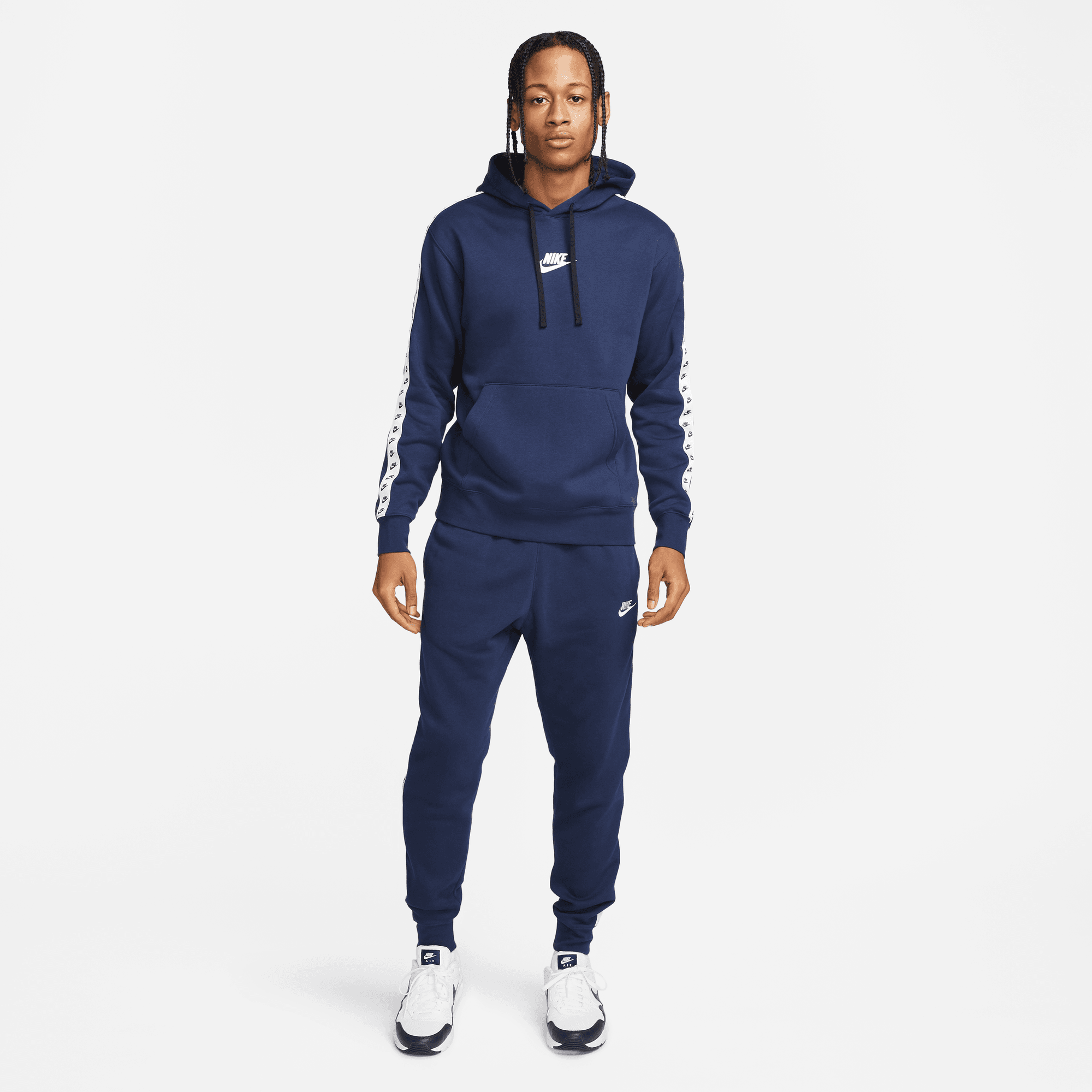 Nike essential tracksuit best sale
