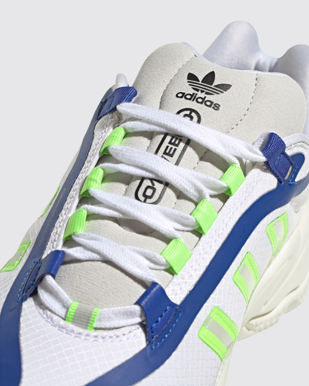 FootkornerAdidas Ozweego - Blanc/Vert/Bleu