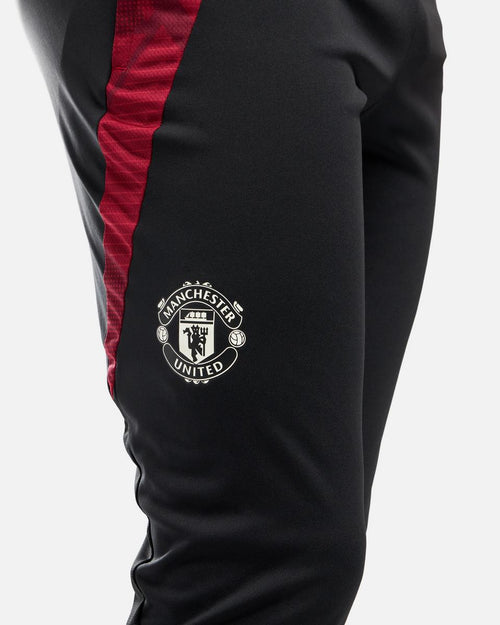 Pantalon d'entrainement Manchester United 2024/2025 - Noir/Rouge - Footkorner