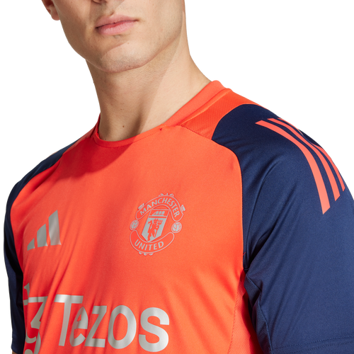 Manchester United training jersey 2024/2025 - Orange/Blue - Footkorner