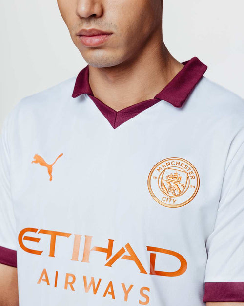 Manchester City Away Jersey 2023/2024 - White/Orange/Bordeaux - Footkorner