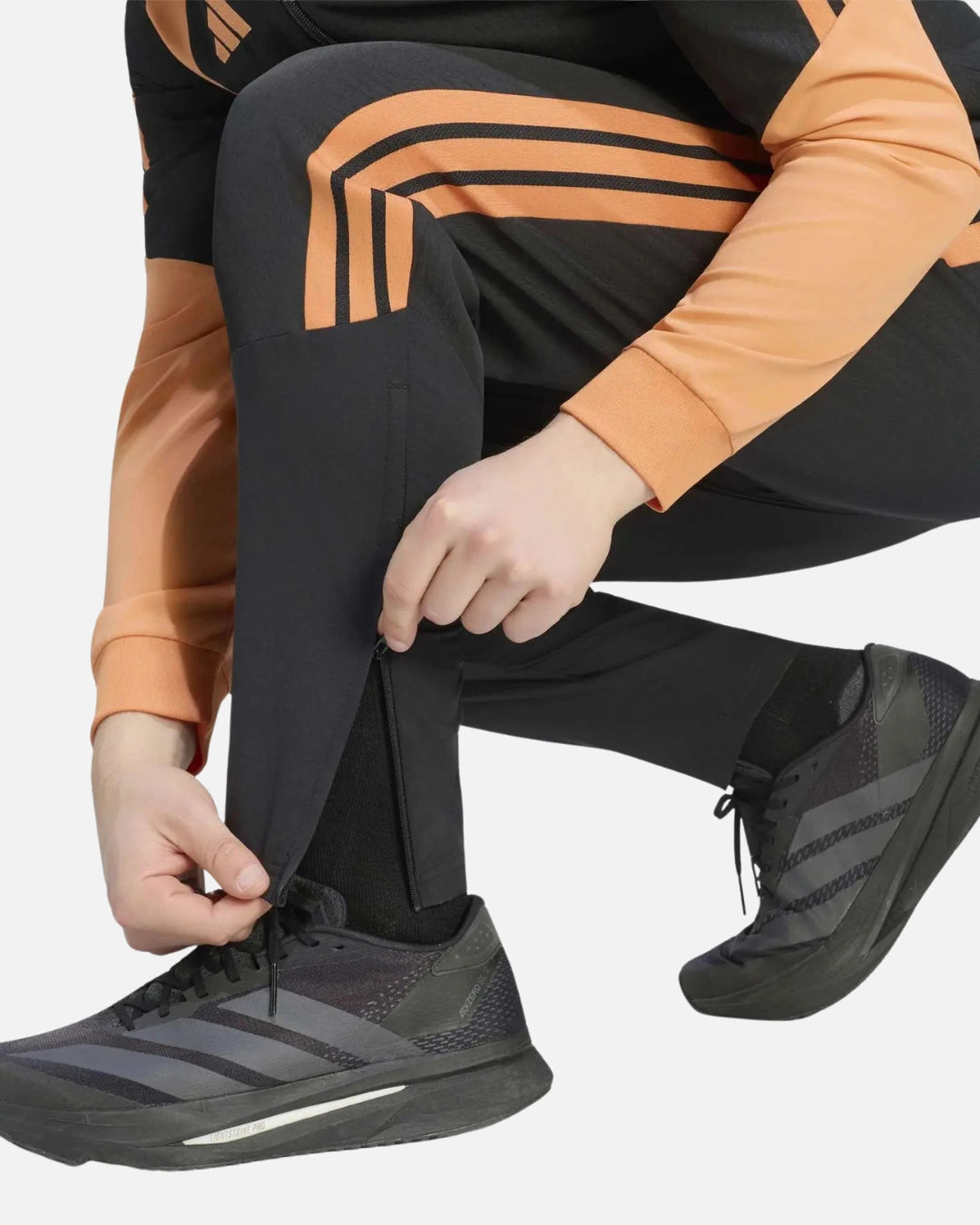 FootkornerPantalon Arsenal FC 2026/2027 Tiro - Noir/Orange