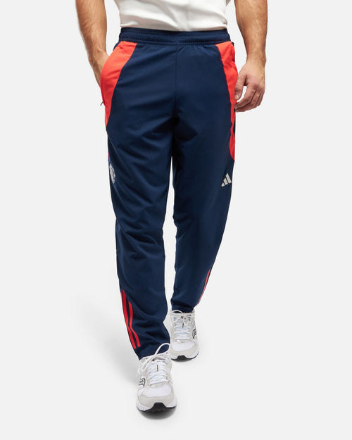 Pantaloni della tuta Manchester United 2024/2025 - Blu/Arancione - Footkorner