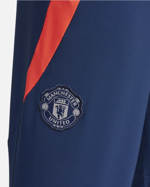Pantaloni della tuta Manchester United 2024/2025 - Blu/Arancione - Footkorner