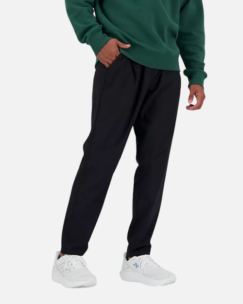 Pantalon New Balance AC Tapered - Noir - Footkorner