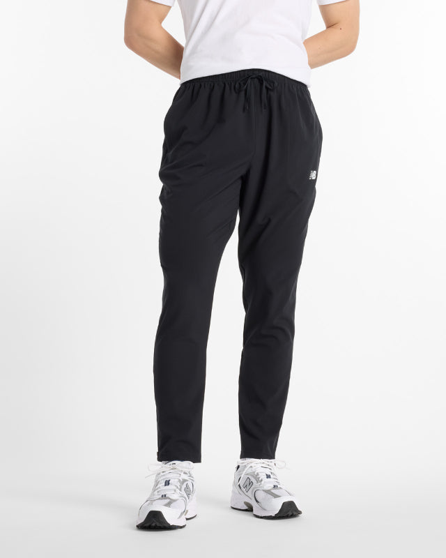 FootkornerPantalon New Balance Sport Woven - Noir