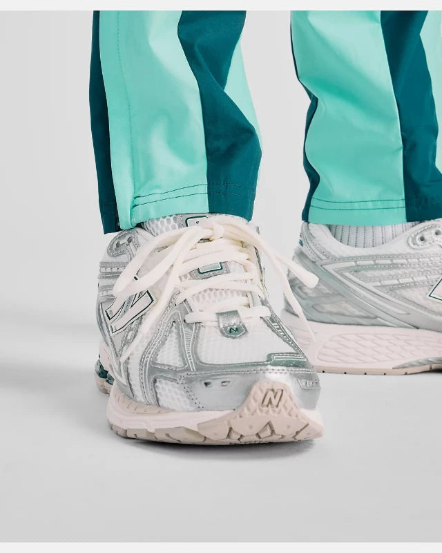 FootkornerPantalon New Balance Utility Woven - Vert