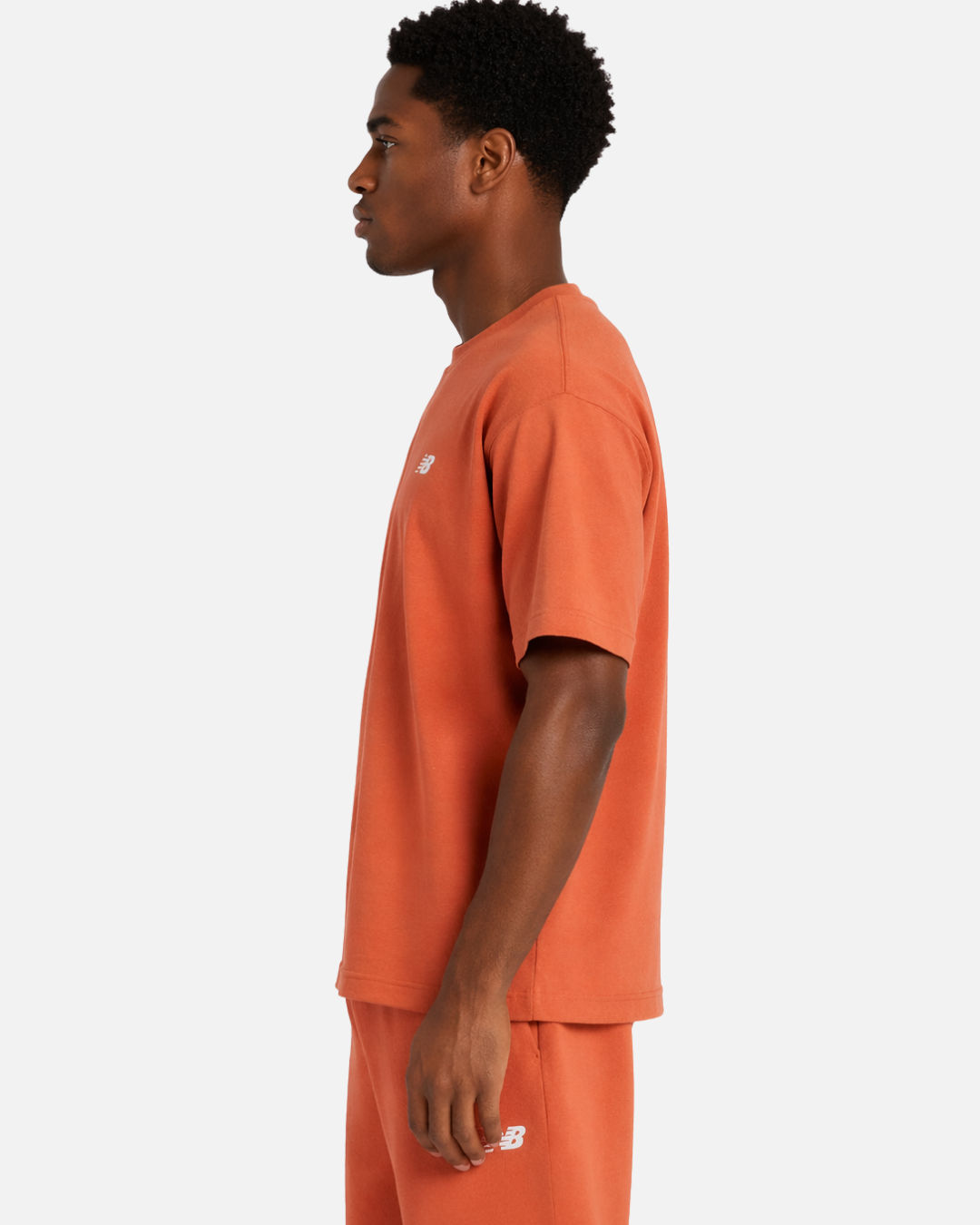 FootkornerT-shirt New Balance Sport Essentials Cotton - Orange