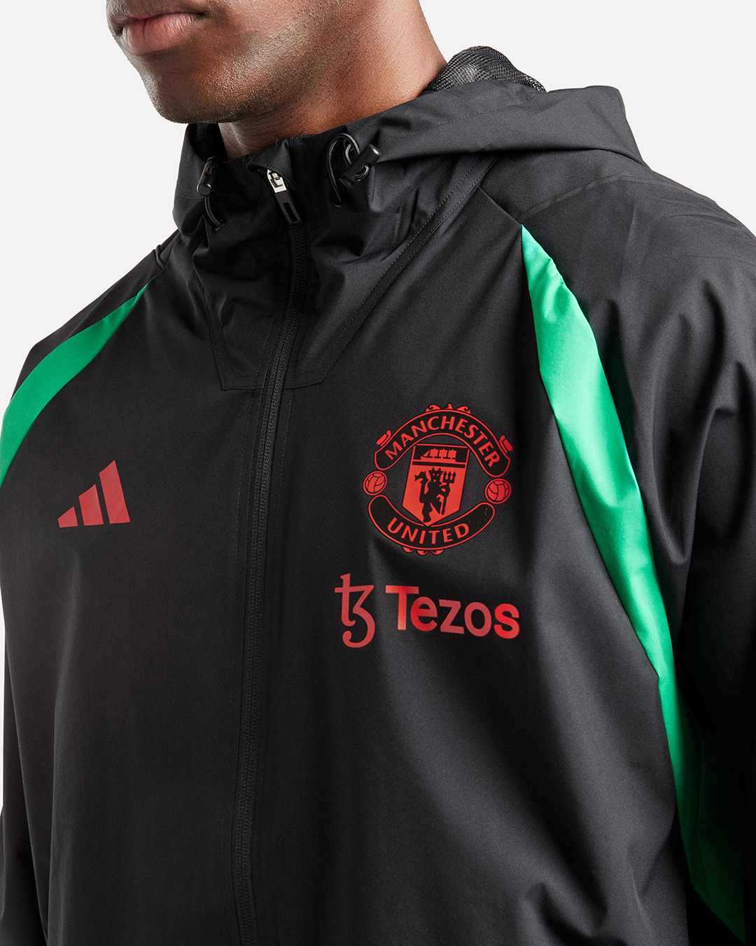 FootkornerVeste Coupe-Vent Manchester United 2023/2024 - Noir/Rouge/Vert