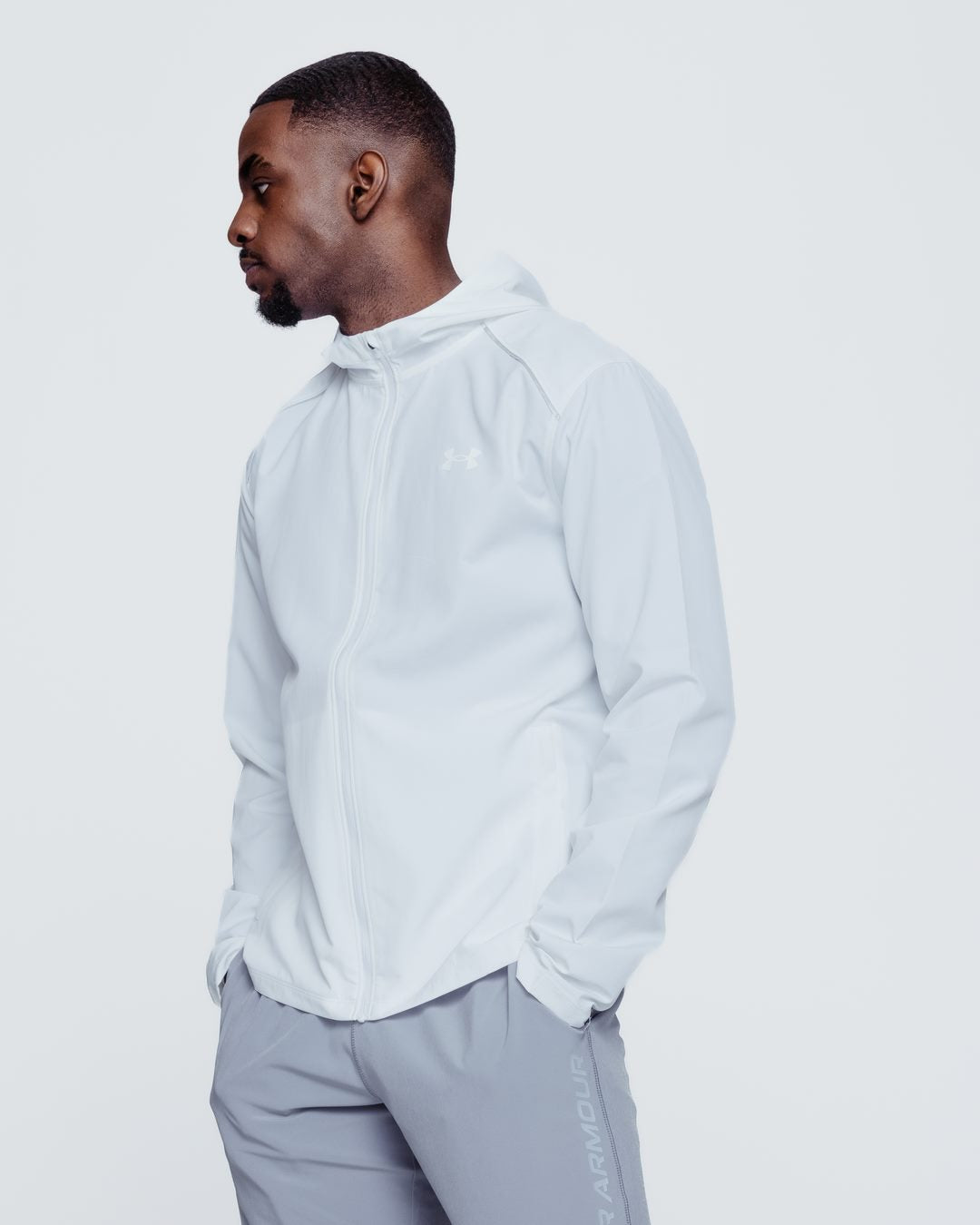 FootkornerChaqueta de chándal Under Armour Running Storm - Blanco