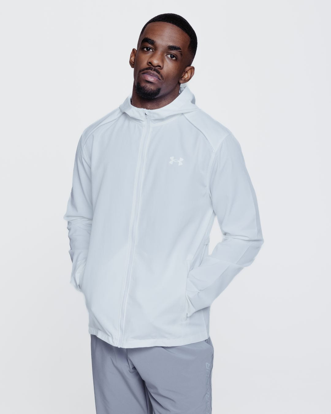 FootkornerChaqueta de chándal Under Armour Running Storm - Blanco