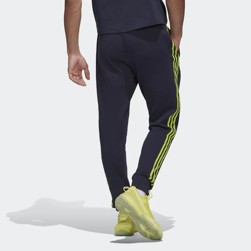 FootkornerPantaloni da allenamento Lifestyler del Manchester United - Blu/Verde 