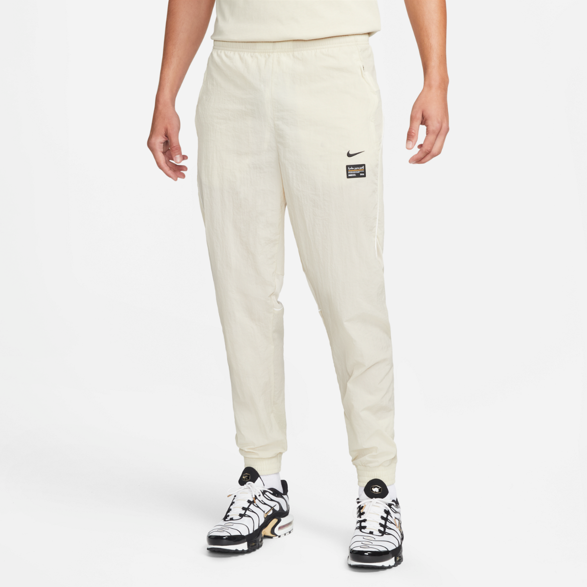Pantaloni da jogging in tessuto Nike FC - Beige