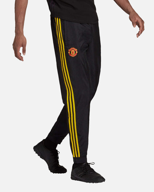 Pantaloni della tuta Manchester United Icon - Nero/Giallo - Footkorner
