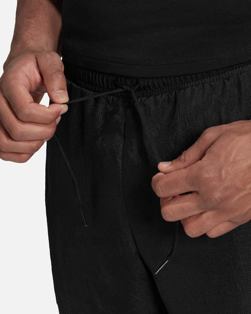 Pantaloni della tuta Manchester United Icon - Nero/Giallo - Footkorner