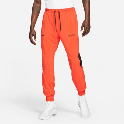 Pantalon tissé Nike FC Joga Bonito - Rouge/Noir - Footkorner