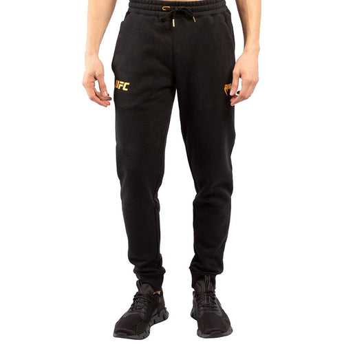 Pantalones deportivos Venum UFC Replica Champion - Negro/Oro - Footkorner